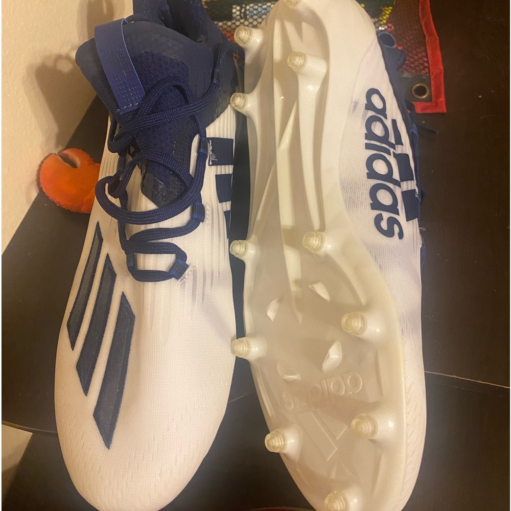 Blue and white football shoes.  Size 11.   Too tight for my son